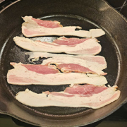 American Guinea hog bacon in a skillet