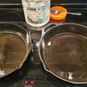 2 large iron skillets with cocoanut oil