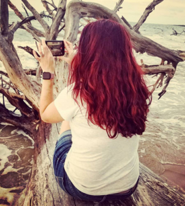 Faith taking a picture at Boneyard beach