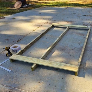 Attaching the deck boards and truing up the skids frame for building our goat tote
