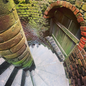 Descending one of the spiral staircases at Fort Clinch.