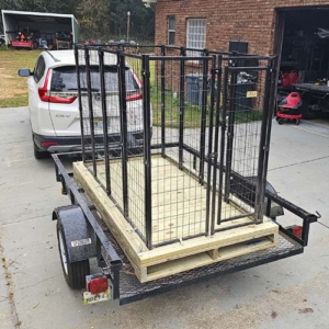 A sturdy livestock transporter that can be pulled with a small SUV.