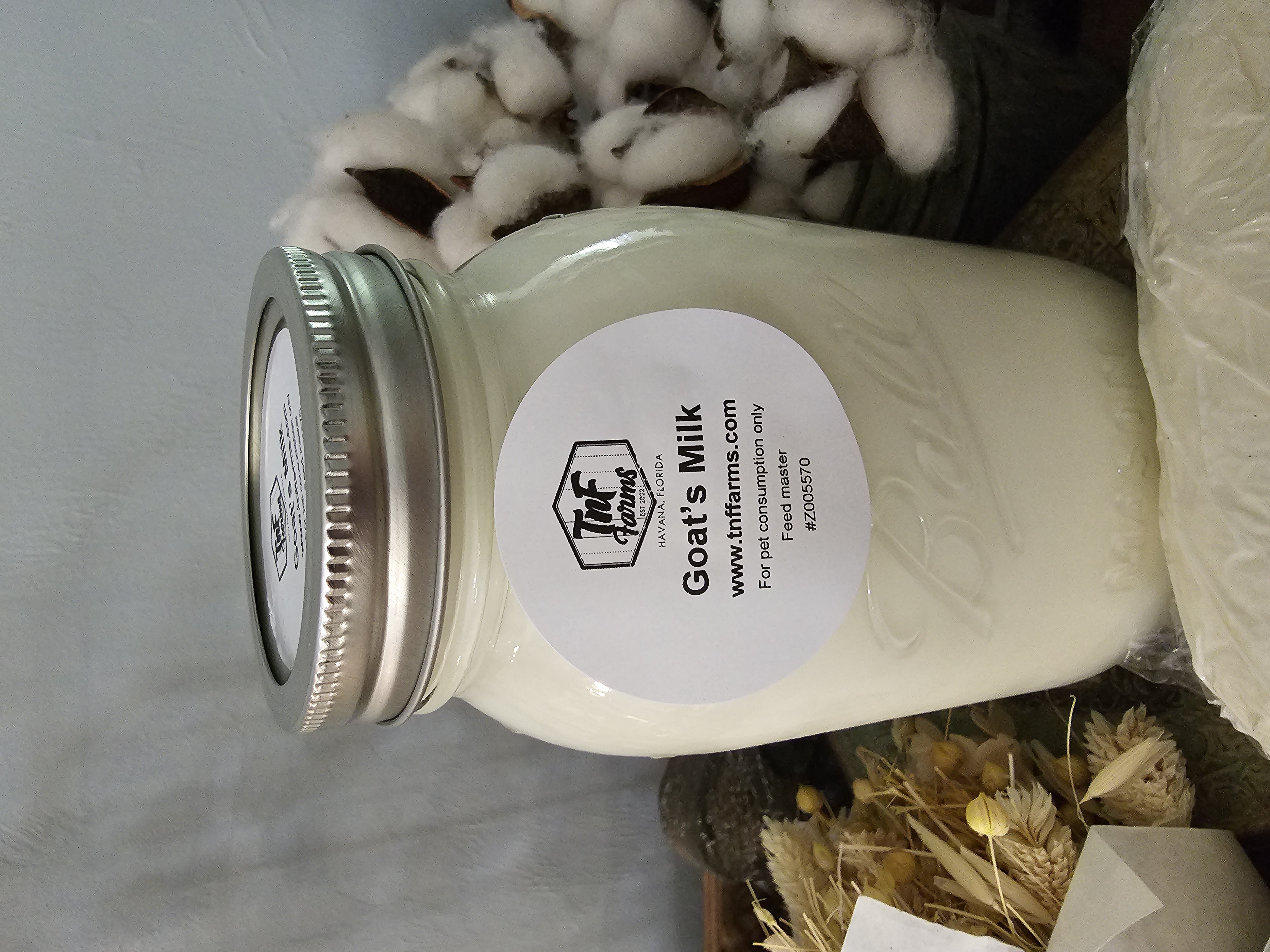 mason jar full of raw goats milk