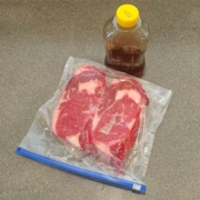 These ribeye steaks are ready to spend 24 hours in the refrigerator after being rubbed in honey