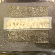 layer of rice in the musubi press