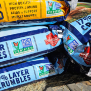 stack of non-GMO chicken feed bags