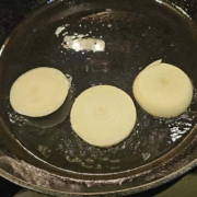 frying onions in an iron skillet