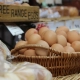 Wicker basket full of brown eggs sign says Free Range Eggs