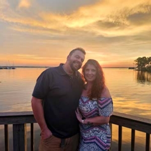 Tim and Faith standing on their neighborhood dock at the St. Johns River.