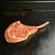 tomahawk steak starting to get seared